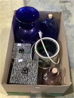 Box includes a beautiful blue tall vase, a blue