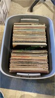 Large plastic tub full of 33 LPs features artists