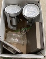 Two spotlight type lights, a stereo speaker, wall