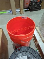2 orange 5 gallon buckets