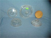 Group of vintage glass and wood storage jar lids