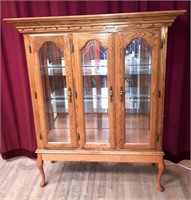 Modern Oak curio cabinet.