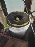 Bucket with green hose