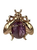 Sterling insect pin with amethyst colored glass