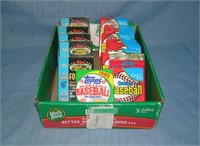 Box full of unopened baseball and football card pa