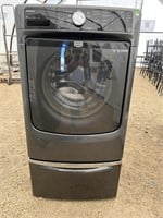 Maytag Maxima X front load washer on a matching