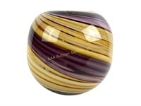Decorative swirled glass vase in purple and gold
