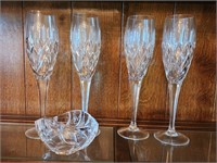 4 Waterford champagne flutes and small bowl.