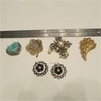 assorted earrings and pins