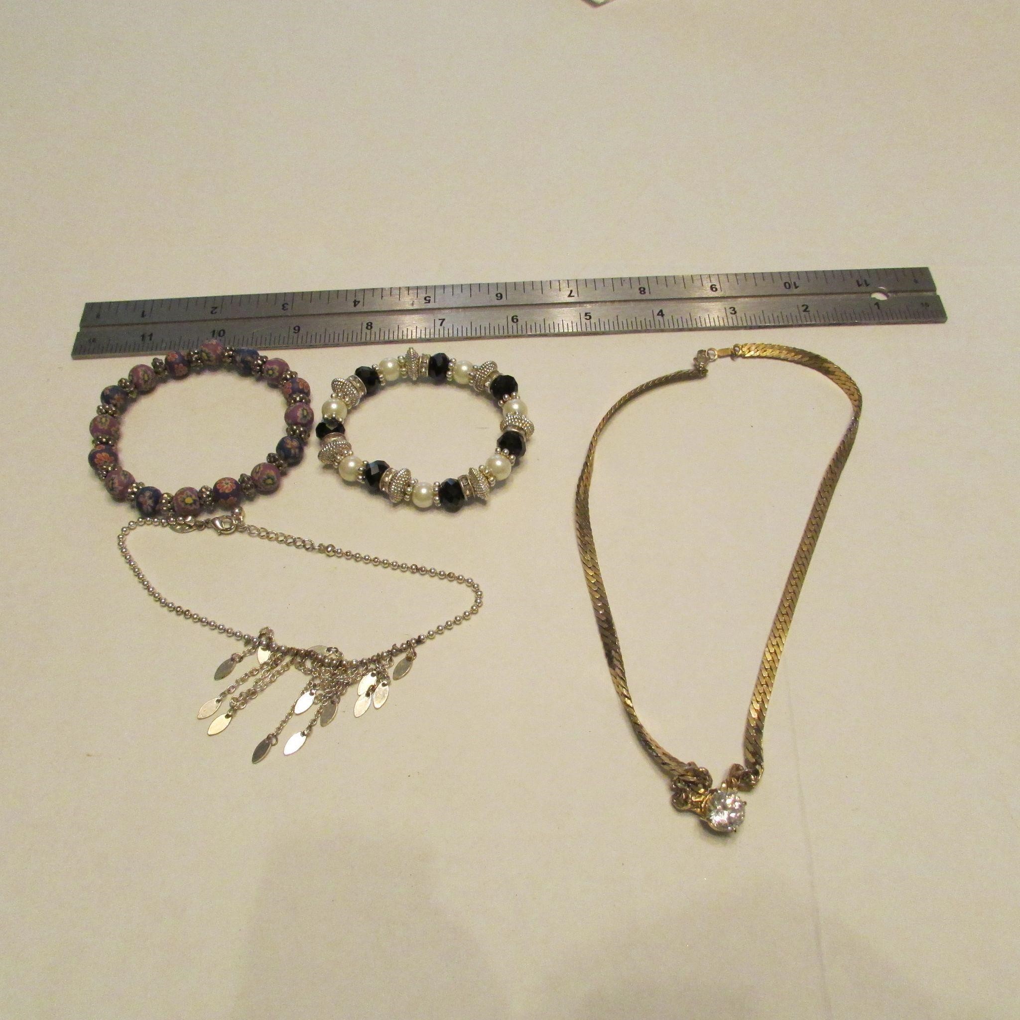 3 bracelets, necklace with clear stone