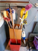 Assorted Mops, brooms, yard sticks, brushes