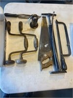 Primitive tools including saws, oil canister,
