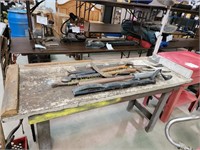 Work bench and contents of Pry bars, oil barrel