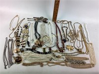 Assorted costume jewelry.  Silver teaspoons