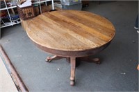 Antique Round Oak Expandable Table Claw Feet