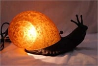 Brass snail decorator lamp w/ amber glass shade,