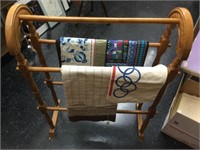 Wood Blanket stand with assorted linens.