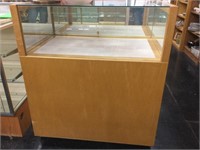 Rolling glass front display cabinet. 36x42x24