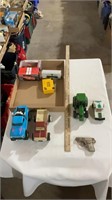 Toy John Deere tractor, toy trucks, cap gun