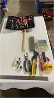 Tool kit, hand tools, measuring tape, nails.