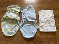 C10) Baby items 2 wraps, 1 thick receiving blanket