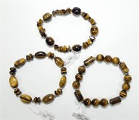 Lot, three tiger eye and sterling silver stretch