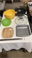 Cutting board, colonel popper, cake pan, plastic