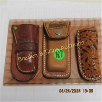 GROUP OF 3 LEATHER SHEATHS FOR FOLDING