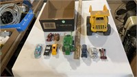 Toy cars, toy combine, toy dump truck