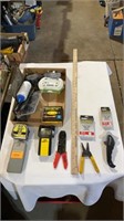 Tape measure, stud finders, wire cutters, staples