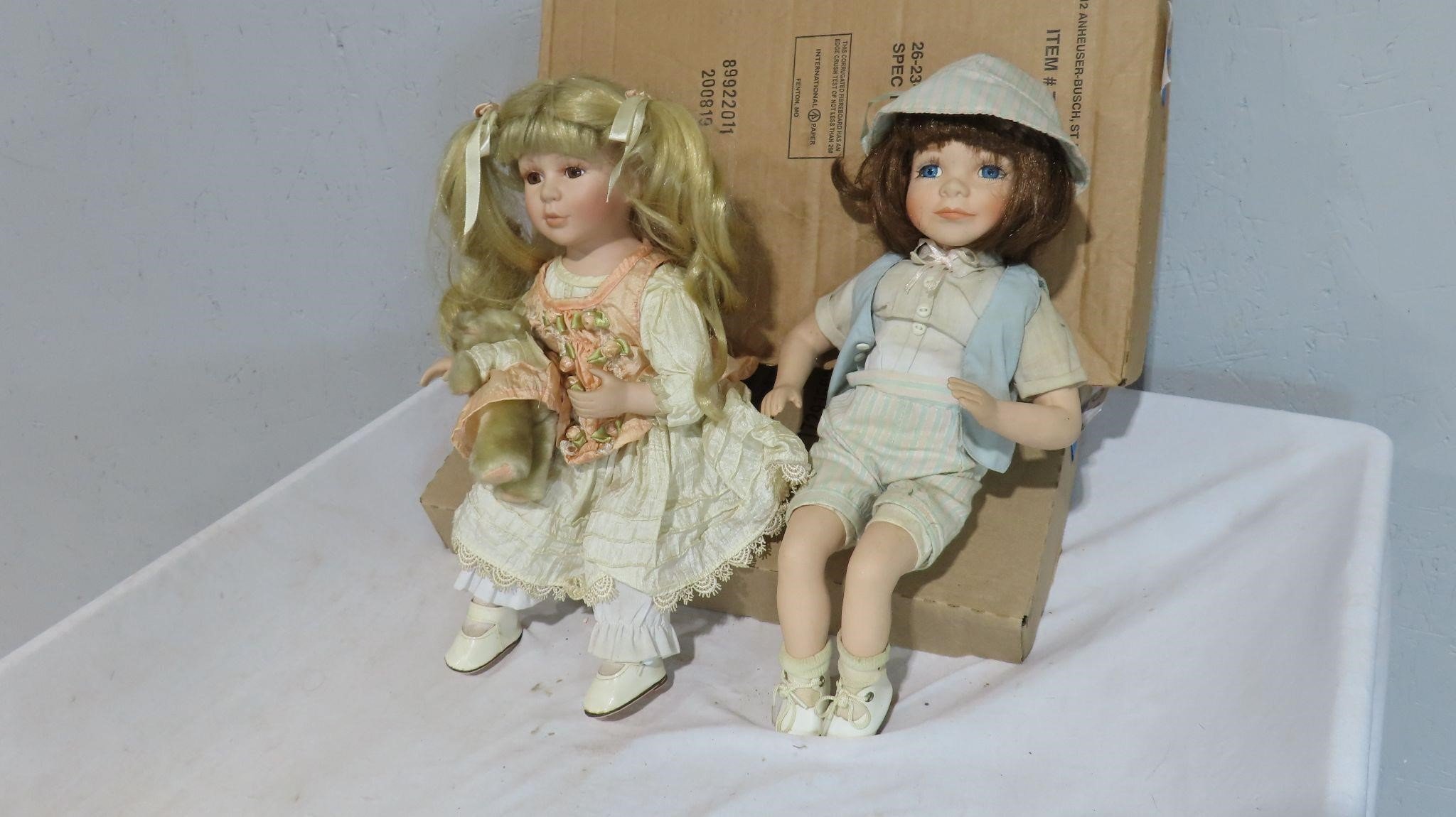 2 vintage ceramic sitting dolls