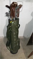Golf clubs in green Fairway bag, various brands