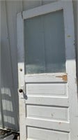 Vintage door with window, door knobs and dead