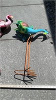 Metal yard art, flamingo, and peacock