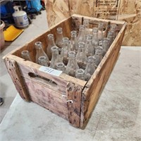 Wooden coke crate w empty bottles