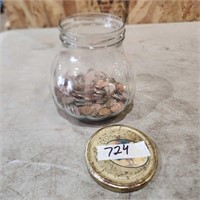 Jar with mostly pennies