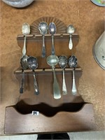COLLECTOR SPOONS IN DISPLAY