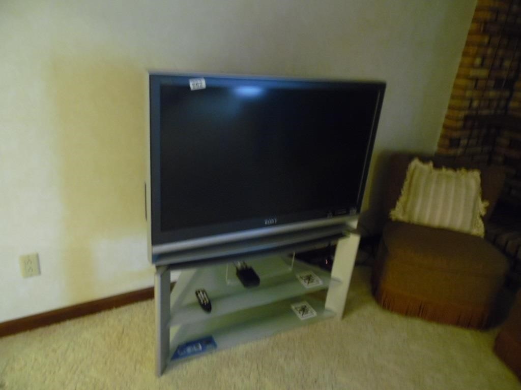 SONY TV WITH STAND LOCATED IN BASEMENT