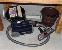 VACUUM AND MOP BUCKET LOCATED IN BASEMENT