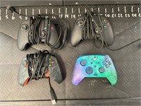 Four Xbox controllers