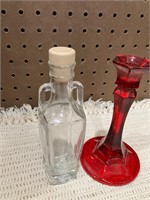 Bottle and red candlestick