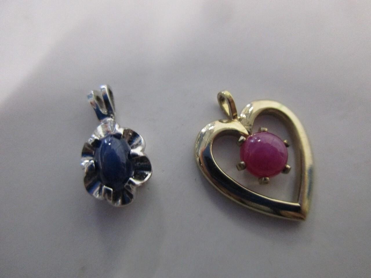 Pink and blue star sapphire pendants