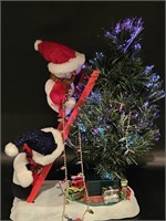 Fiber Optic Snowmen Trimming a Christmas Tree