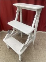 Decorative wooden 3-step stool. Has been used as