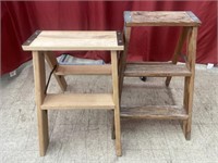 Pair of folding wooden two-step stools.