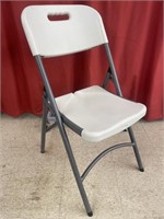 Folding event chair with metal frame and plastic