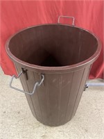 Plastic garbage can with metal handles. No lid.