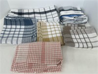 Assortment of new dish cloths and kitchen towels.