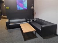 2- BLACK FAUX LEATHER COUCHES W/ TABLE