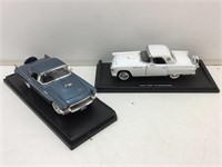 2 DieCast Cars on Stands